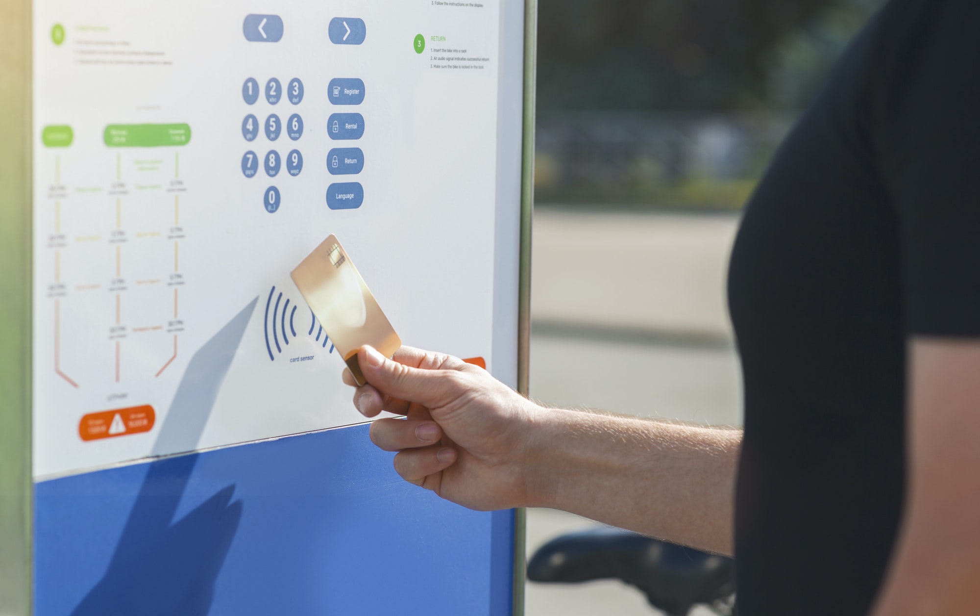 Man paying with contactless payment for bicycle